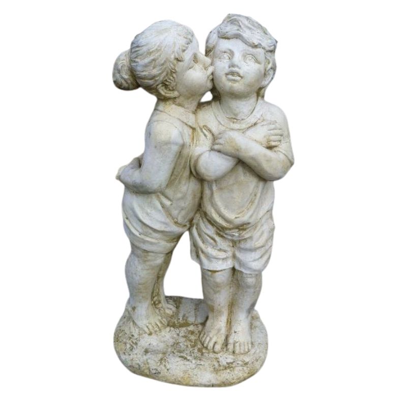 Girl Kissing Boy Statue