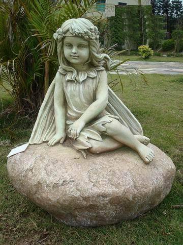 Fairy Leaning on Rock Statue